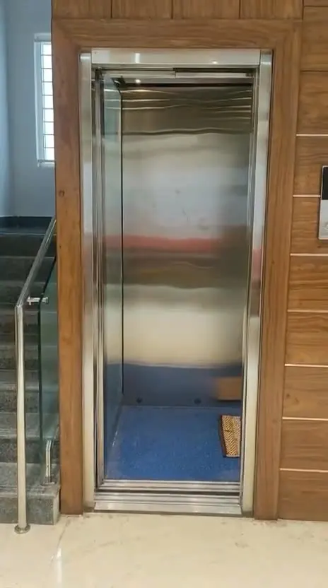 Stainless steel home lift installed by Oriental Lift